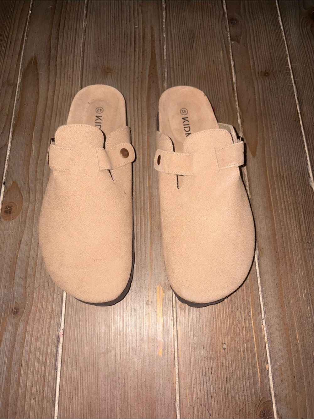 KIDMI tan suede slip-on clogs featuring an adjustable side buckle